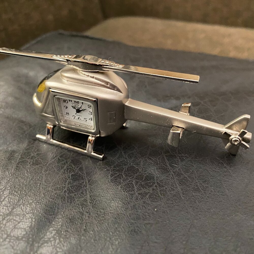 Platinum brand silver tone Helicopter desk clock is stylish and unique